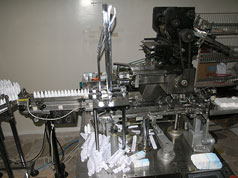 الة تعليب ضمن قسم الكرتنة